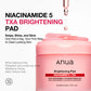 Anua Niacinamide 5 TXA Brightening Pad packaging with pink jar and dropper on a white background