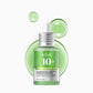 Anua 10+ serum bottle with green droplets on a white background