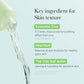 Product dropper with text about exosome cica, heartleaf, and tea tree leaf water on a light blue background