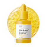 Yellow serum bottle with dropper on a white background