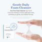 Gentle Daily Foam Cleanser with a hand holding the cleanser and a certification badge on a white background.